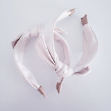 White faux leather headband with bow