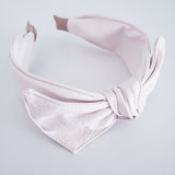 White faux leather headband with bow