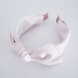 White faux leather headband with bow
