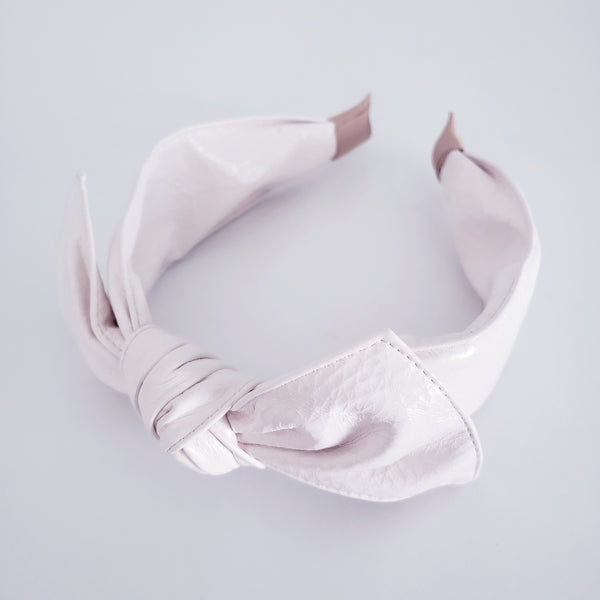 White faux leather headband with bow