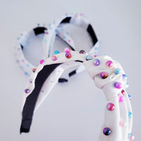 White and iridescent pearl knotted headband hair accessory